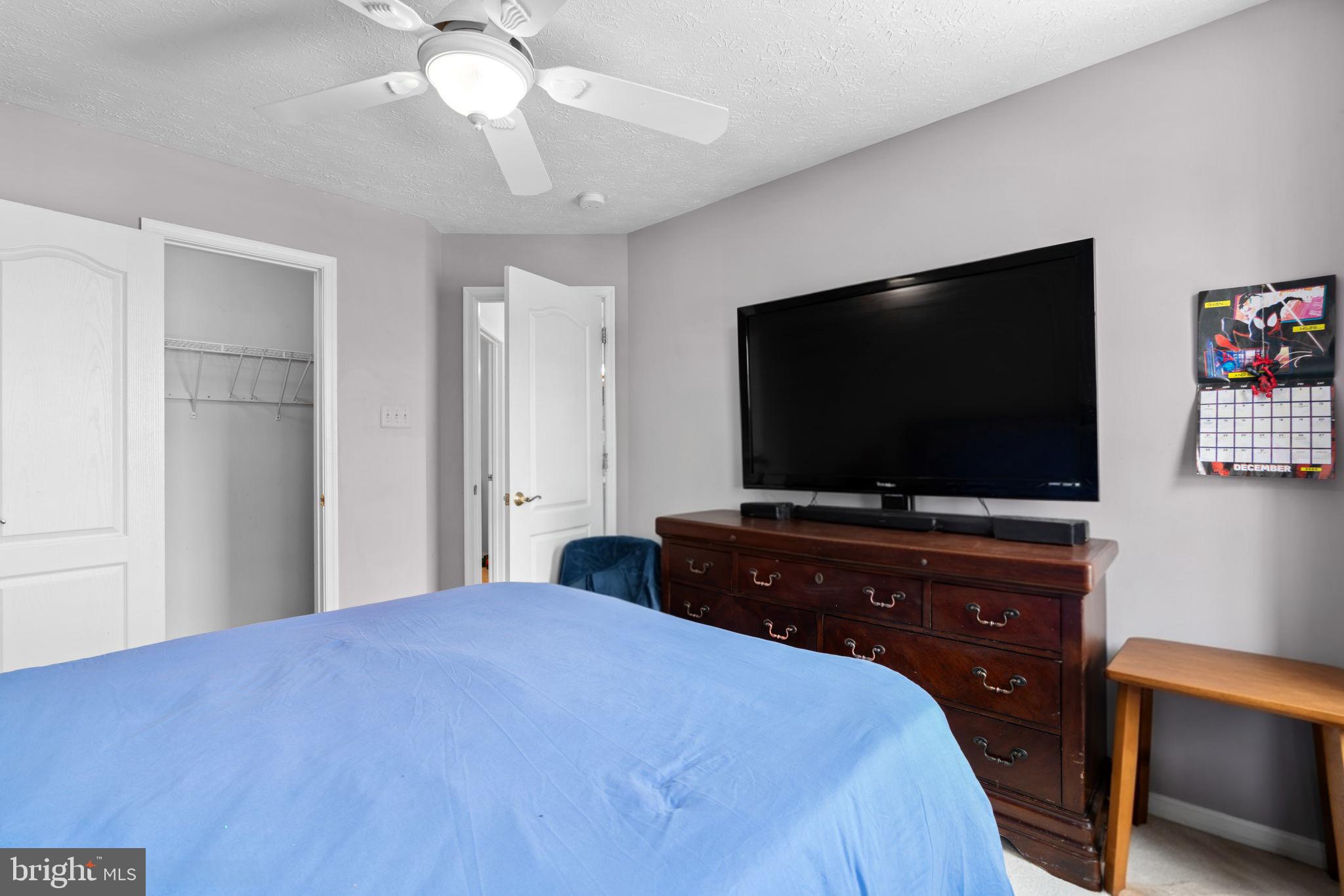 22 Dovefield Road Perry Hall, MD 21128 - Photo 27 of 46 a bedroom with a bed and a flat screen tv