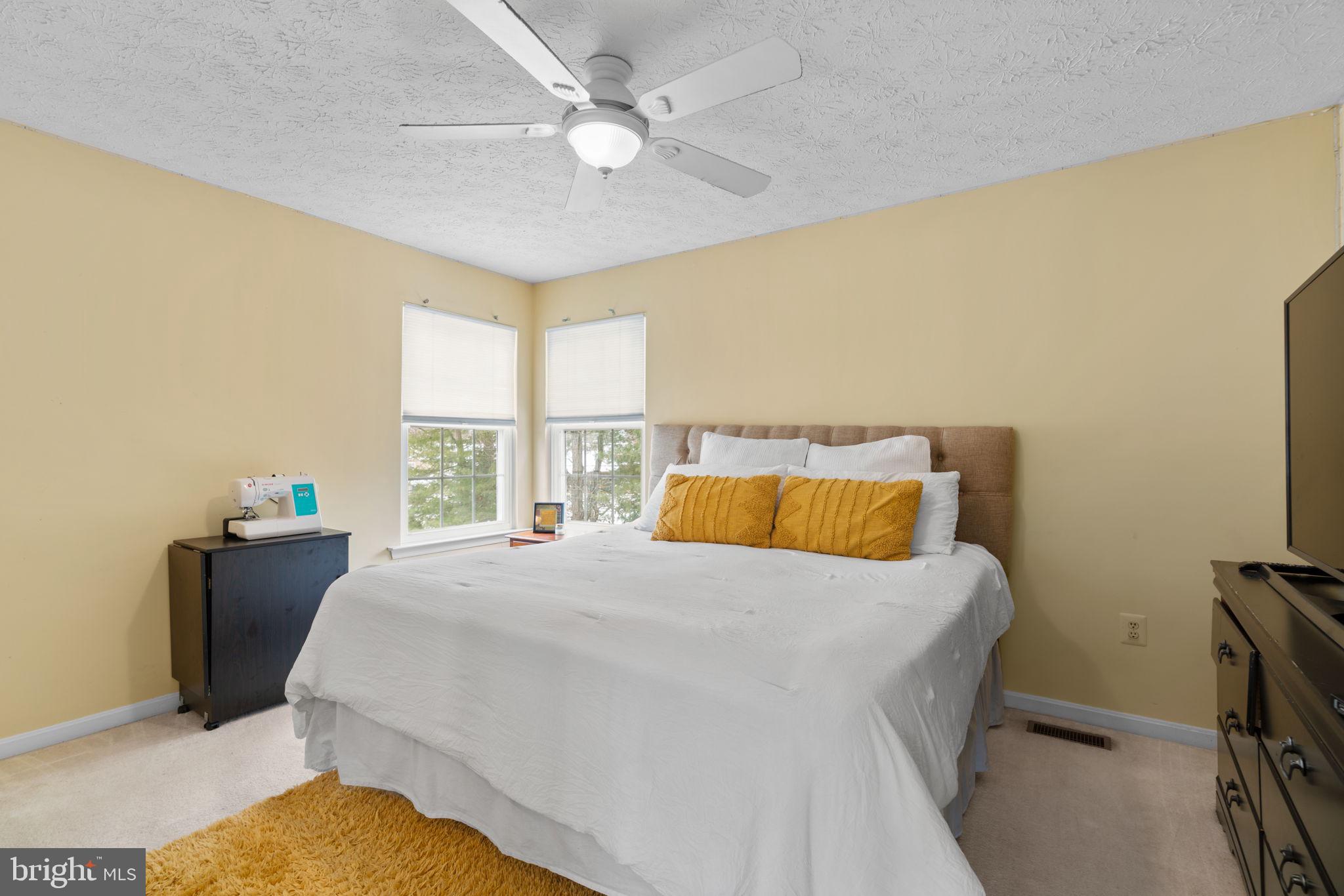 22 Dovefield Road Perry Hall, MD 21128 - Photo 28 of 46 a bedroom with a bed dresser and a window