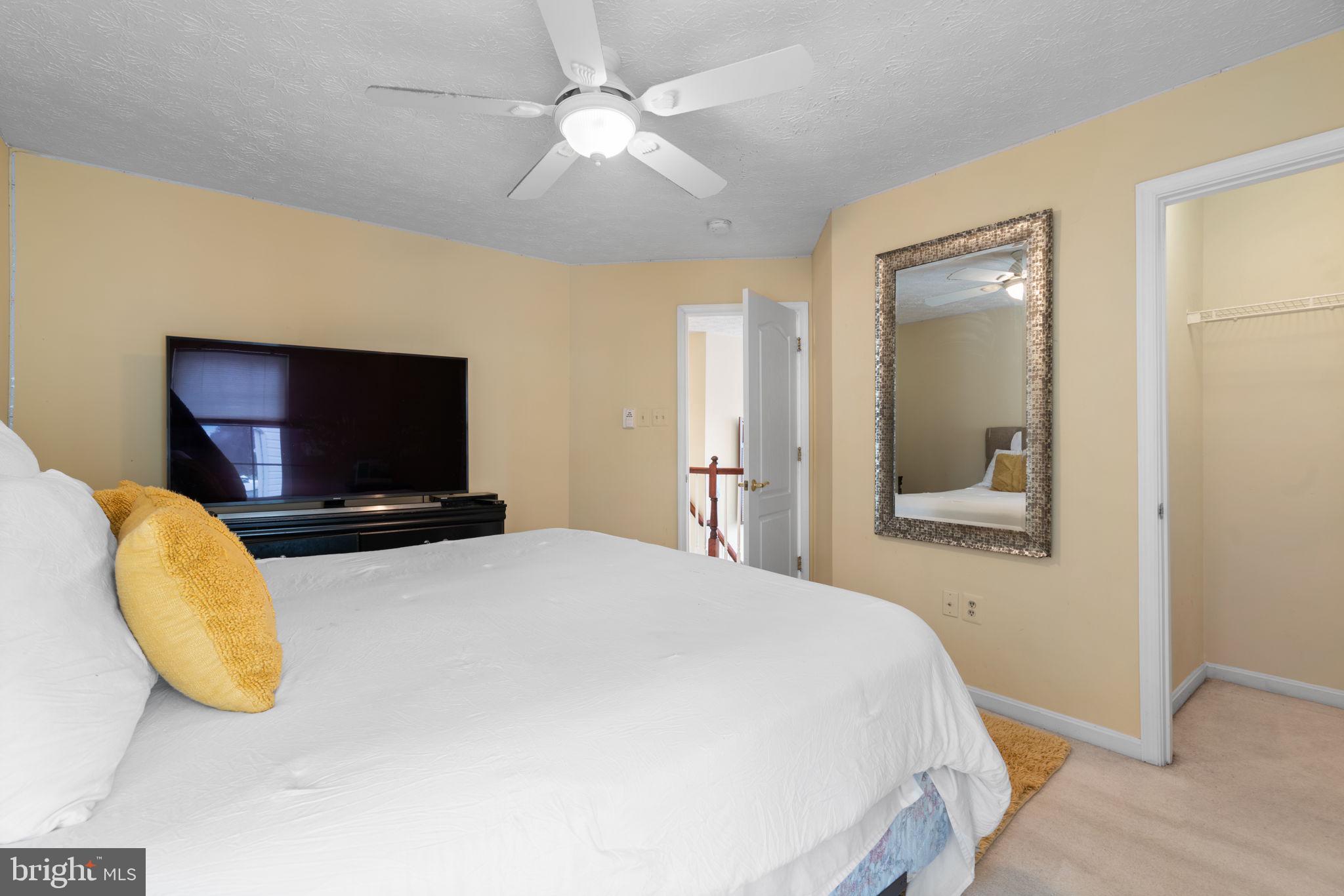 22 Dovefield Road Perry Hall, MD 21128 - Photo 29 of 46 a bedroom with a bed and a flat screen tv