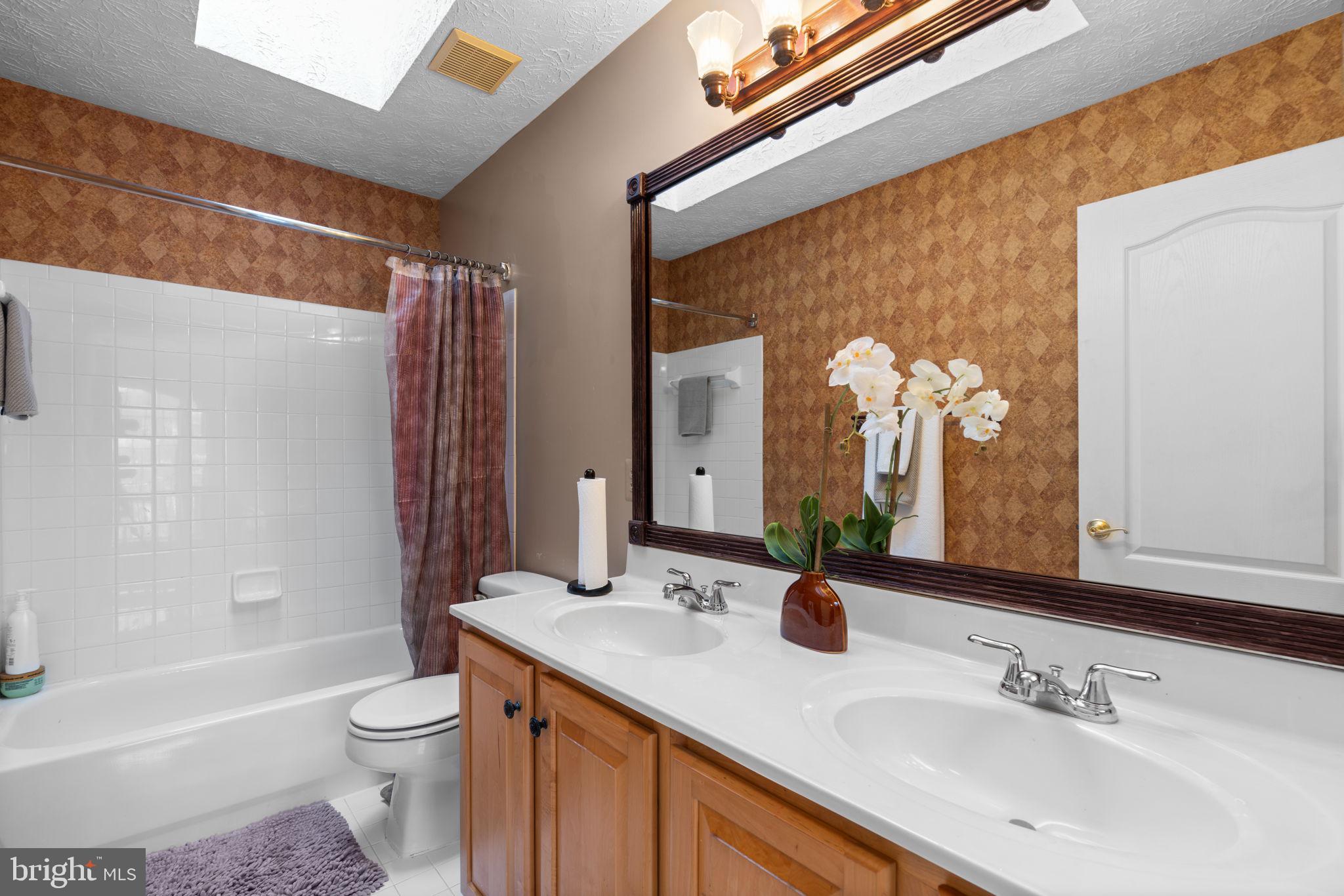 22 Dovefield Road Perry Hall, MD 21128 - Photo 30 of 46 a bathroom with a sink a toilet and shower