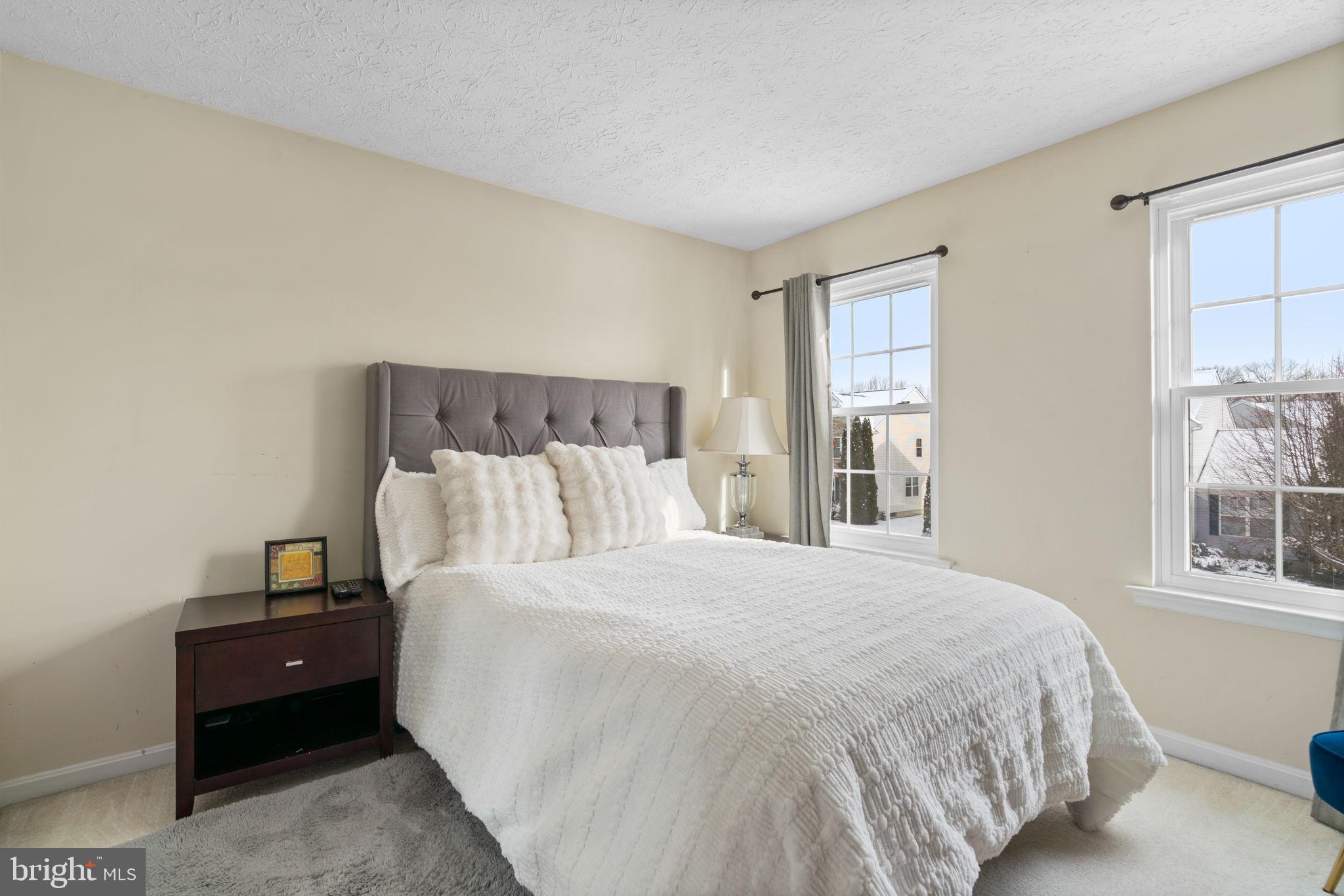 22 Dovefield Road Perry Hall, MD 21128 - Photo 31 of 46 a large bed sitting in a bedroom next to a window