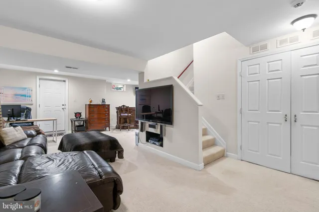 a bed room with furniture and a flat screen tv