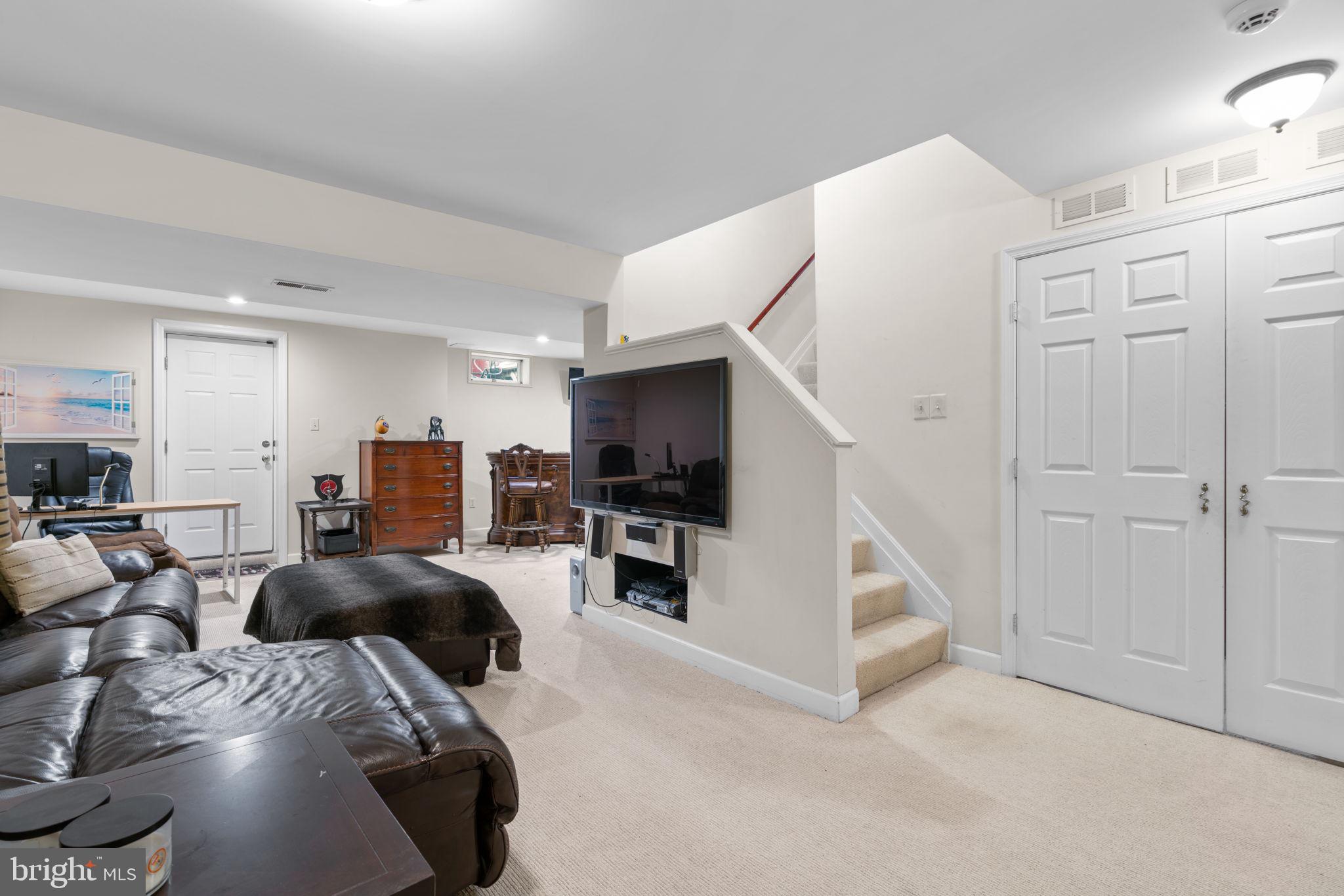 22 Dovefield Road Perry Hall, MD 21128 - Photo 34 of 46 a bed room with furniture and a flat screen tv