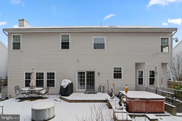 a outdoor space with patio the couches and a fireplace