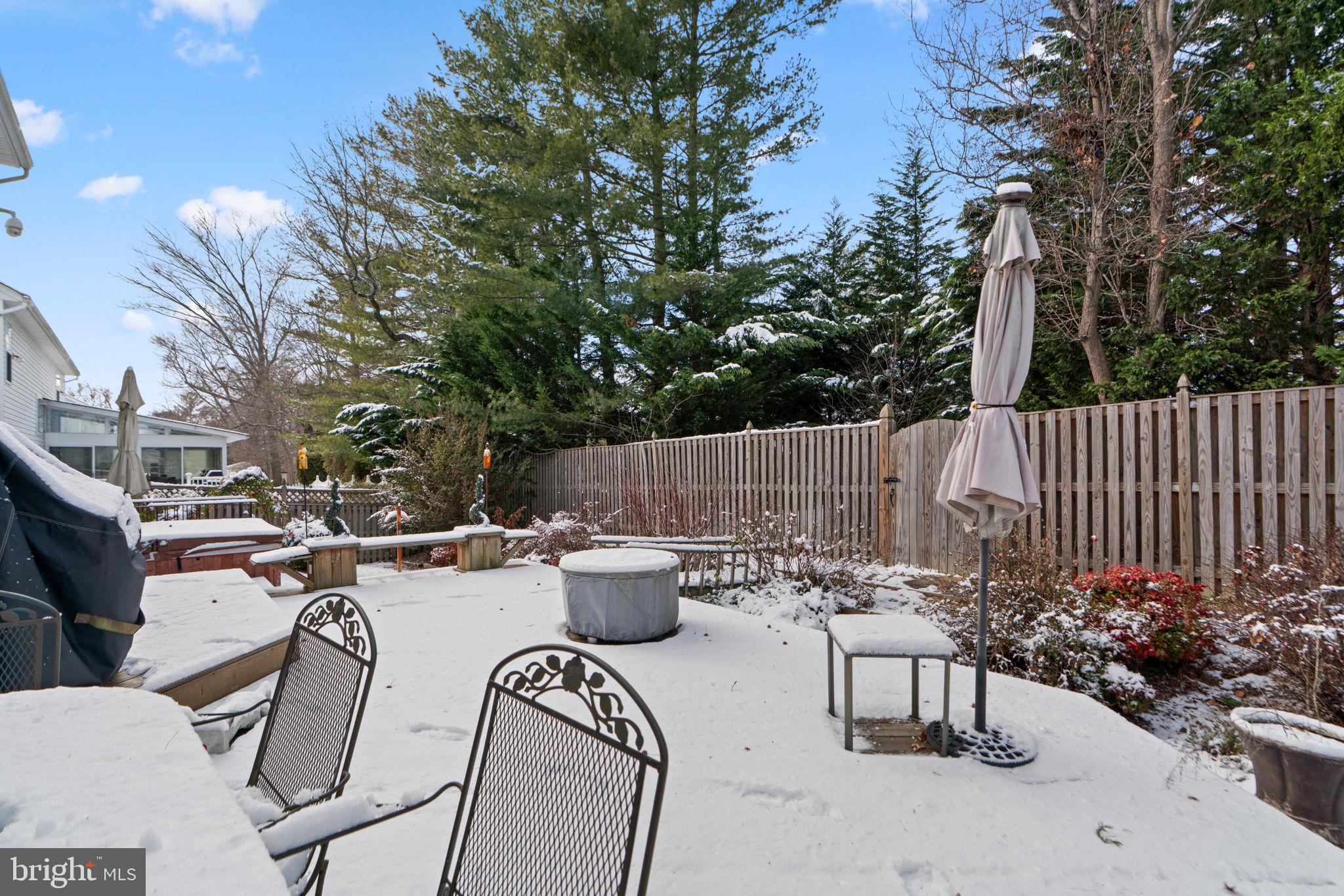 22 Dovefield Road Perry Hall, MD 21128 - Photo 44 of 46 a view of a patio with table and chairs potted plants and tree