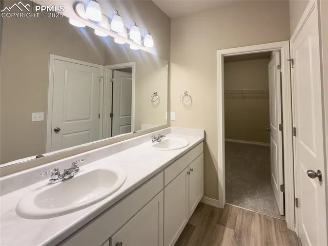 a white toilet sitting next to a shower