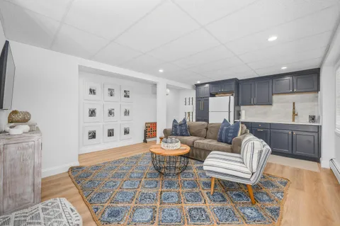 a living room with furniture and a rug