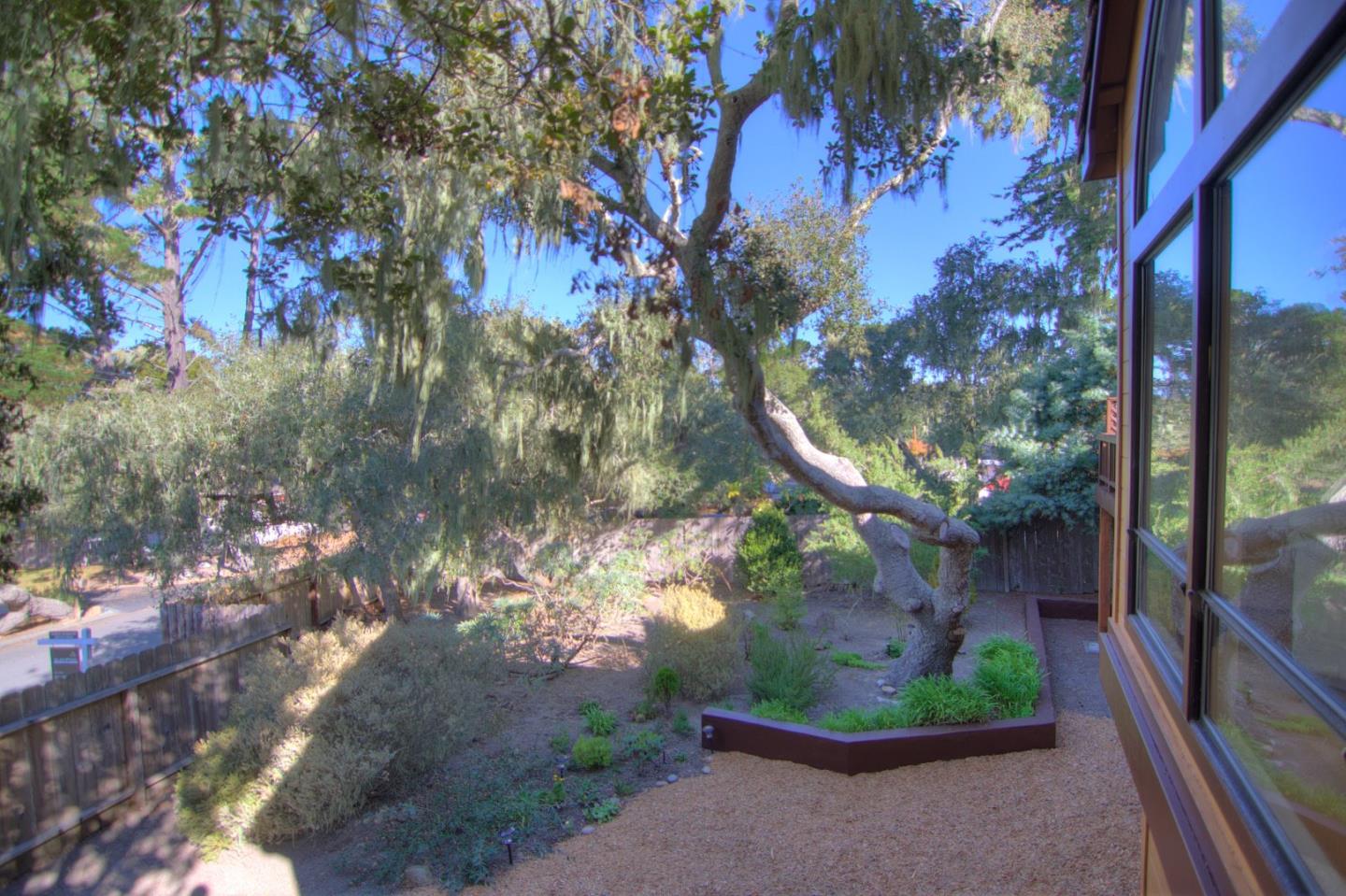 3062 Sloat Road Pebble Beach, CA 93953 - Photo 23 of 24 a view of a house with a tree in front of it