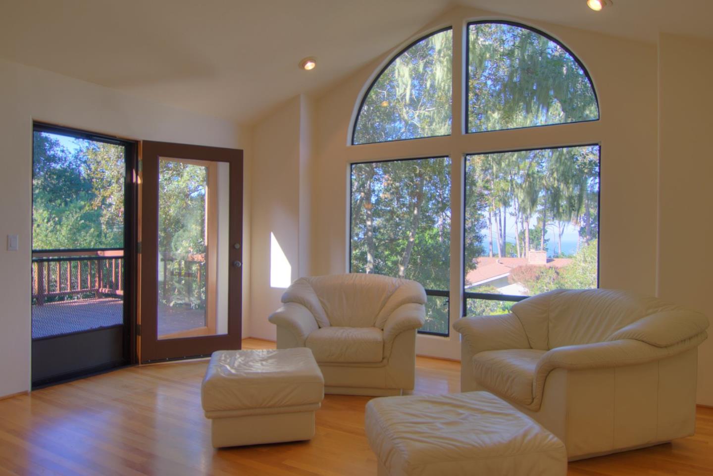 3062 Sloat Road Pebble Beach, CA 93953 - Photo 8 of 24 a living room with furniture and a large window