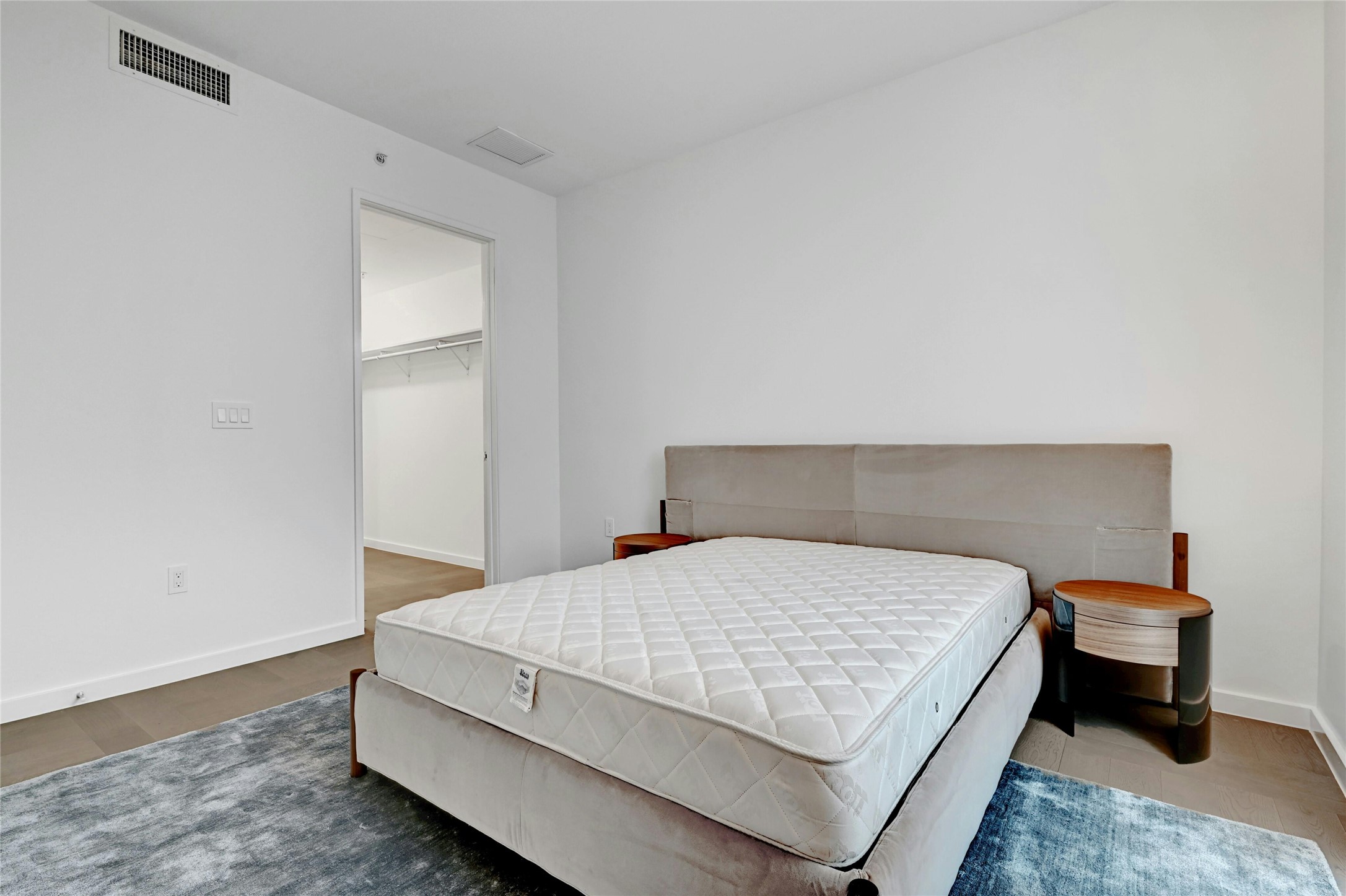 313 West 17th Street, Unit 2306 Austin, TX 78701 - Photo 9 of 35 Step into this sleek and contemporary bedroom featuring floor-to-ceiling windows that frame spectacular views of the city and beyond. Furnishings provided by Scott + Cooner available for purchase separately.