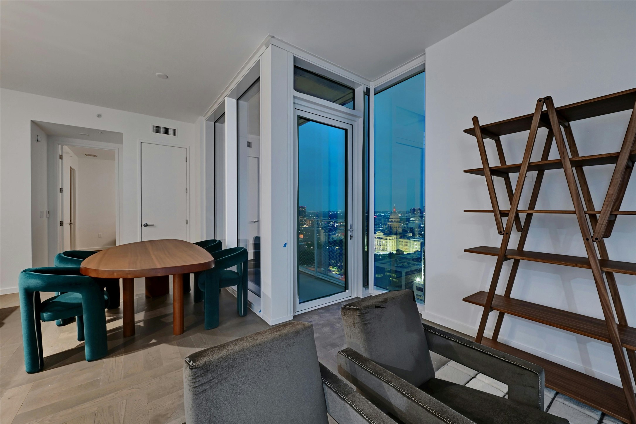 313 West 17th Street, Unit 2306 Austin, TX 78701 - Photo 7 of 35 The dining area offers a perfect setting to enjoy meals while soaking in the breathtaking panoramic city view. Furnishings provided by Scott + Cooner available for purchase separately.