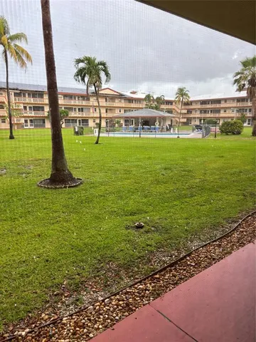 a view of a golf course with a garden