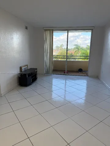 en empty room with a large window