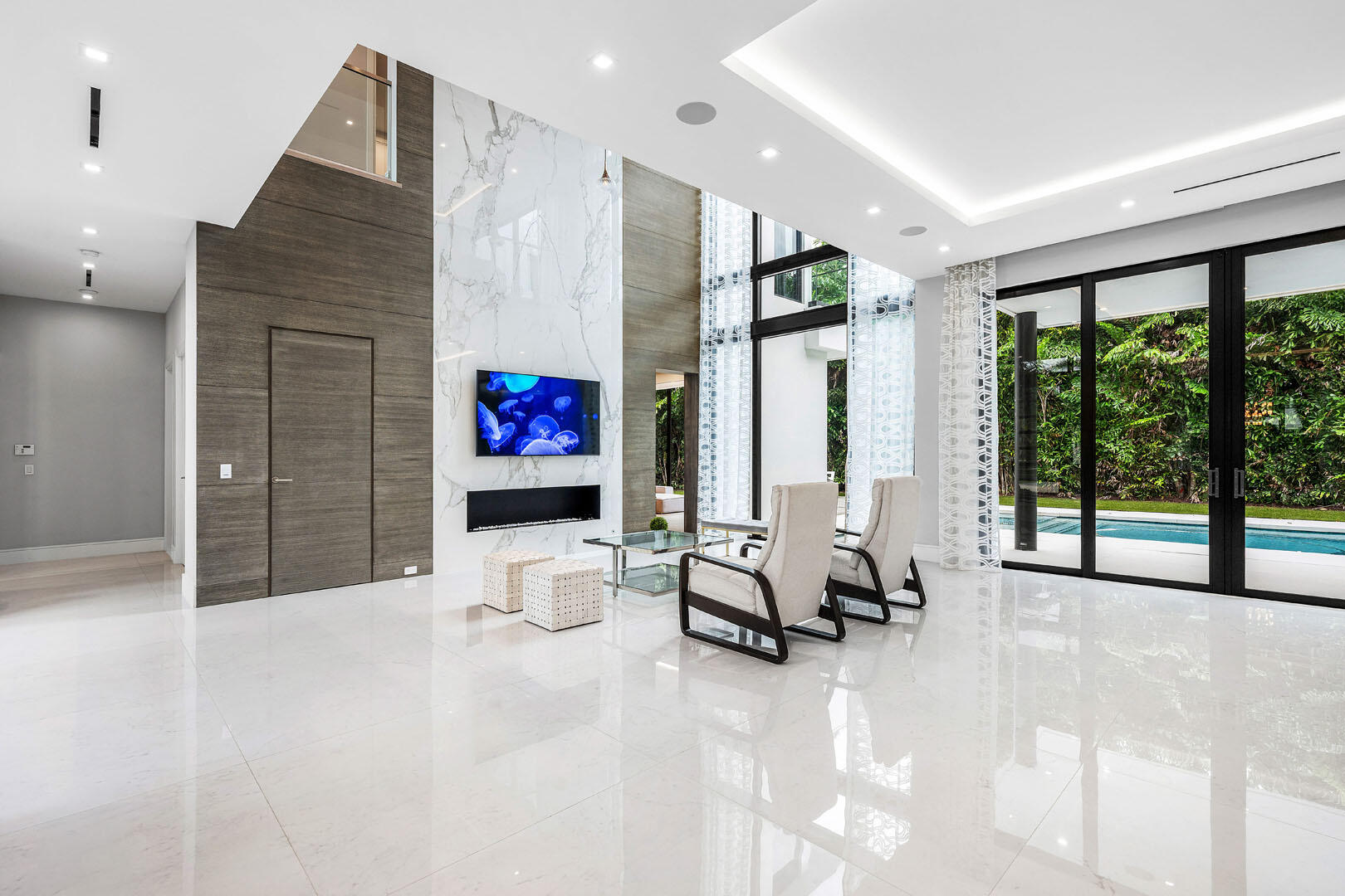 2391 Areca Palm Road Boca Raton, FL 33432 - Photo 15 of 82 a view of a living room with furniture and floor to ceiling window