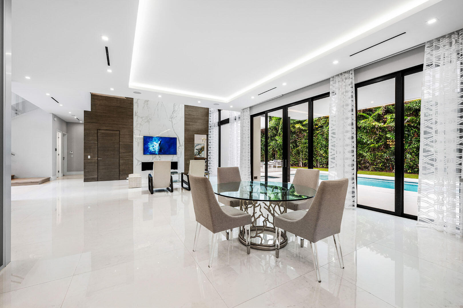 2391 Areca Palm Road Boca Raton, FL 33432 - Photo 26 of 82 a dining room with furniture water view and large windows