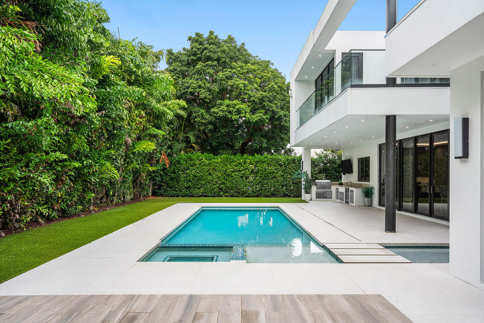 2391 Areca Palm Road Boca Raton, FL 33432 - Photo 32 of 82 a view of swimming pool with chairs in patio