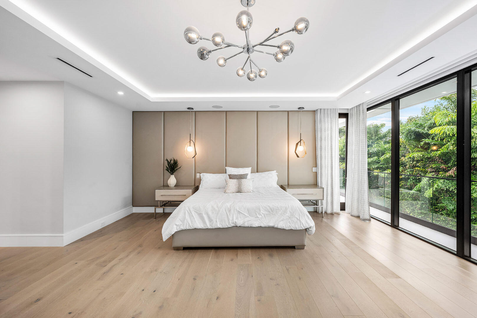 2391 Areca Palm Road Boca Raton, FL 33432 - Photo 53 of 82 a spacious bedroom with a bed and large windows