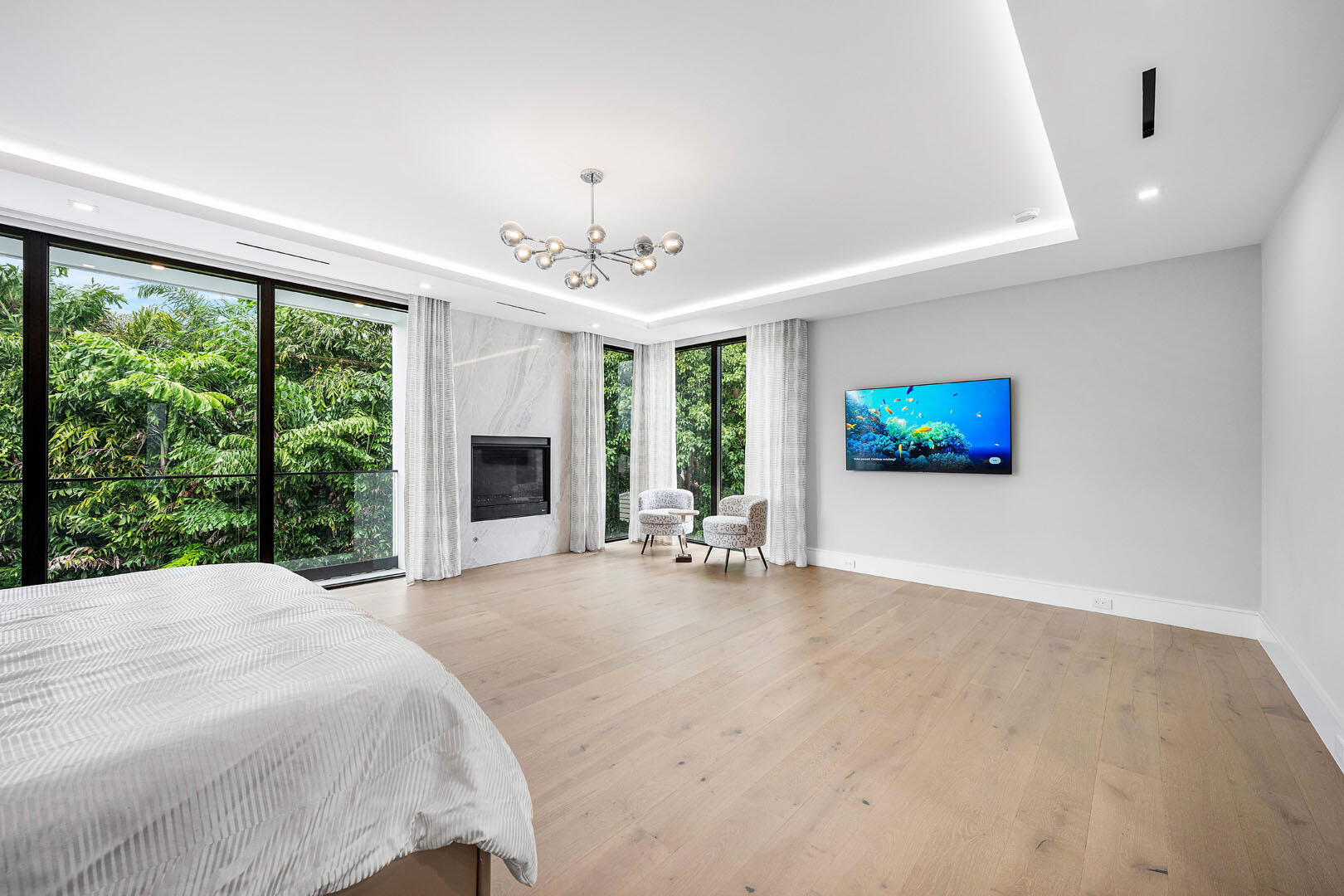 2391 Areca Palm Road Boca Raton, FL 33432 - Photo 56 of 82 a very nice looking room with a large window and a flat screen tv