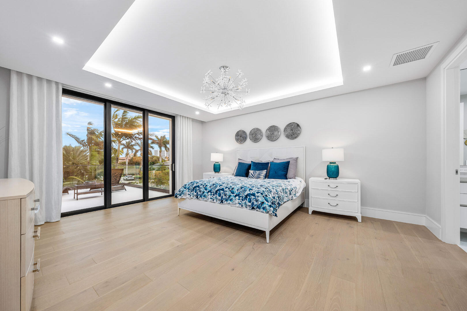 2391 Areca Palm Road Boca Raton, FL 33432 - Photo 63 of 82 a bedroom with furniture and large windows