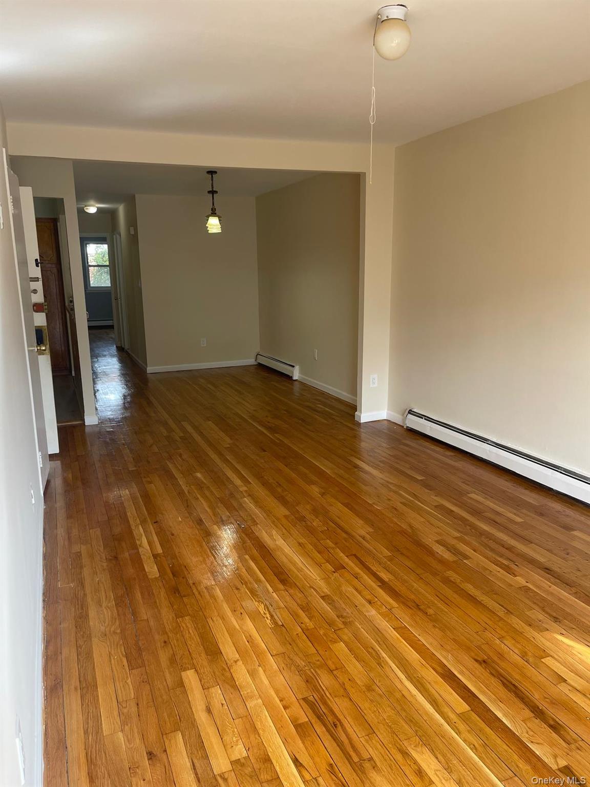 110-21 55th Avenue Queens, NY 11368 - Photo 12 of 29 a view of a livingroom with wooden floor