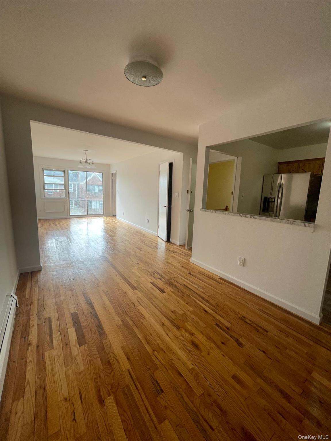 110-21 55th Avenue Queens, NY 11368 - Photo 28 of 29 a view of empty room with wooden floor