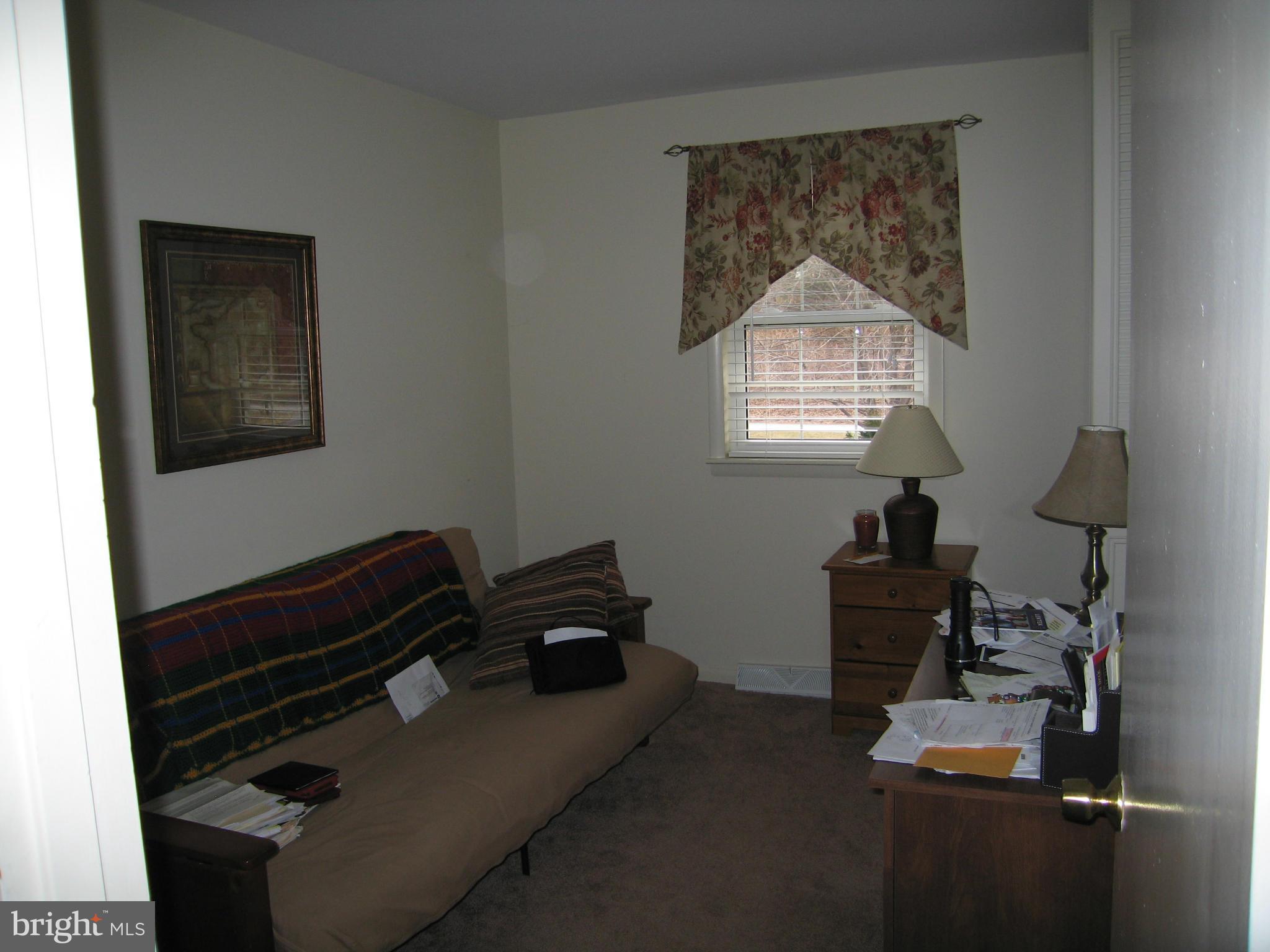 11922 Big Spring Road Clear Spring, MD 21722 - Photo 8 of 17 a bedroom with a bed and a window