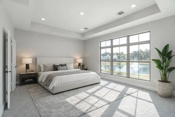 a spacious bedroom with a large bed and a large window