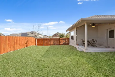 a view of a backyard with patio