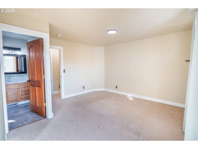 a view of a kitchen cabinets and wooden floor