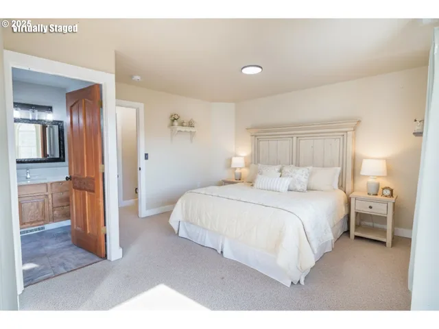 a bedroom with a bed and a view of bathroom