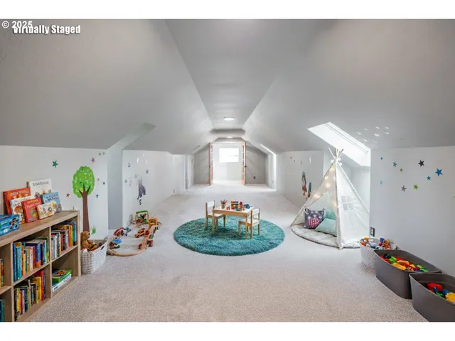 a living room with furniture and a book shelf
