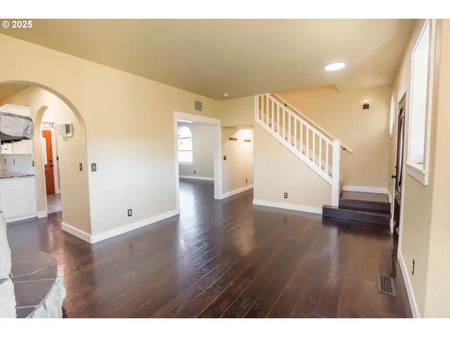 a view of an entryway with wooden floor