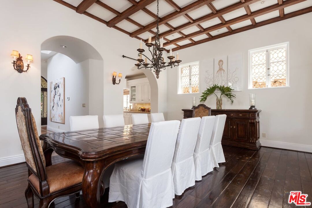 703 Palisades Beach Road Santa Monica, CA 90402 - Photo 15 of 37 a view of a dining room with furniture and wooden floor