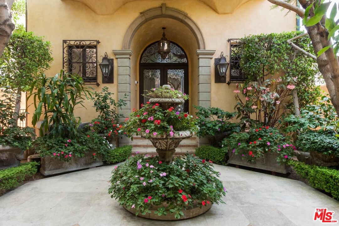 703 Palisades Beach Road Santa Monica, CA 90402 - Photo 5 of 37 a front view of a house with a garden