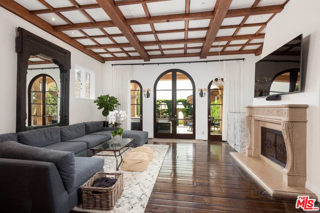 703 Palisades Beach Road Santa Monica, CA 90402 - Photo 8 of 37 a living room with furniture and a fireplace