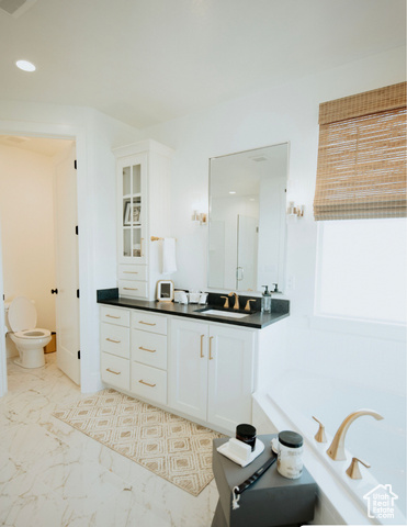 1577 North 1350 E Street, Unit 1 Mapleton, UT 84664 - Photo 7 of 15 Full bathroom featuring vanity, a garden tub, recessed lighting, and marble look tile flooring