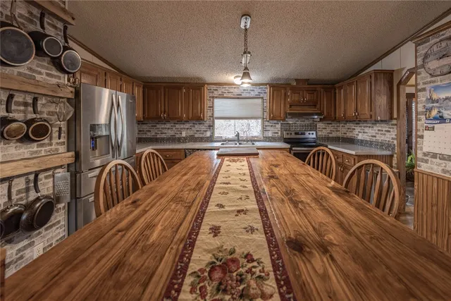 a view of a kitchen with lots of counter top space