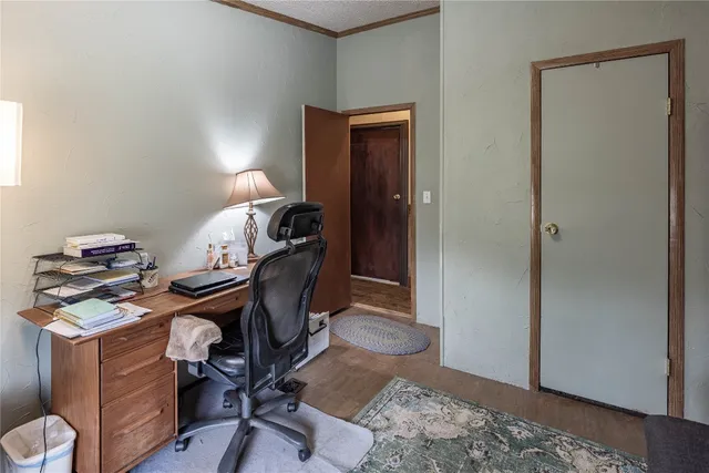 a view of workspace with wooden floor
