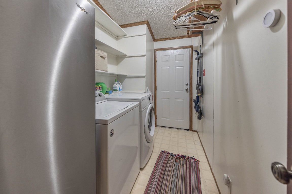 715 Bee Gee Road Driftwood, TX 78619 - Photo 33 of 40 a kitchen with a refrigerator and a stove