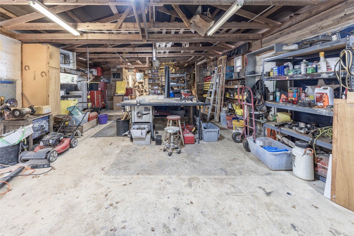 715 Bee Gee Road Driftwood, TX 78619 - Photo 34 of 40 a view of a storage room with a lot of stuff