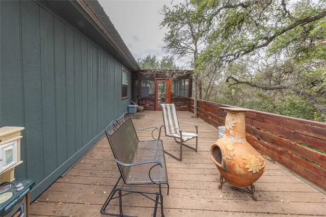 a view of a chairs and tables in the balcony