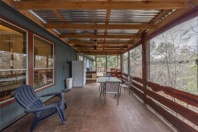 a view of balcony with furniture