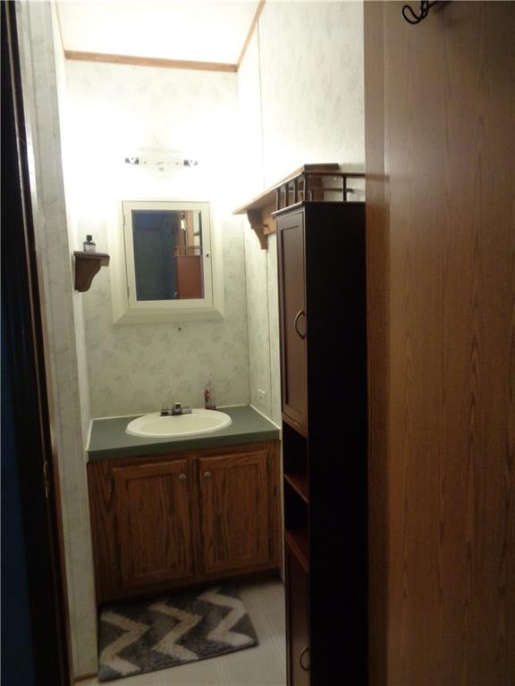 14 Ruby Drive Grove City, PA 16127 - Photo 13 of 17 a bathroom with a sink and a mirror