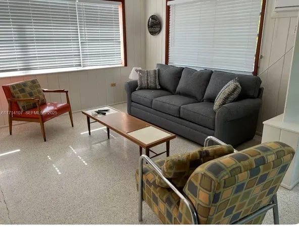 a kitchen with a window a sink and cabinets