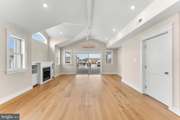 a large kitchen with stainless steel appliances kitchen island wooden cabinets and granite counter tops