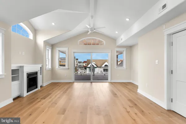 a large kitchen with stainless steel appliances granite countertop a large counter top and a stove top oven