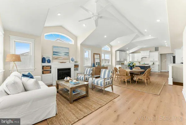 a kitchen with stainless steel appliances white cabinets and a stove top oven