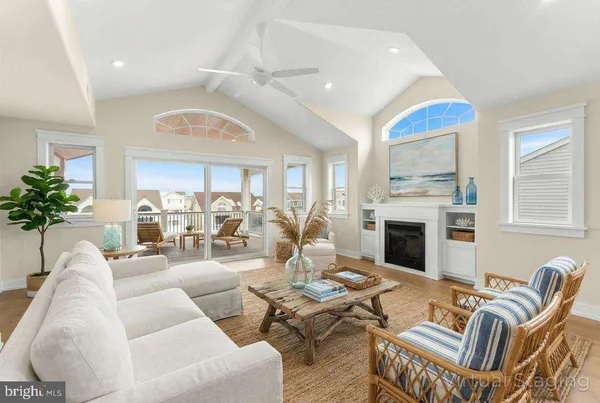 a view of a kitchen with kitchen island a large counter space a sink and appliances
