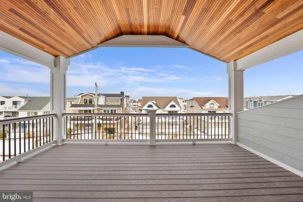 a kitchen with a sink a refrigerator and cabinets