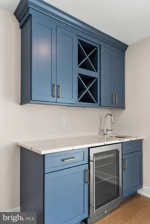 a kitchen with a sink cabinets and stainless steel appliances